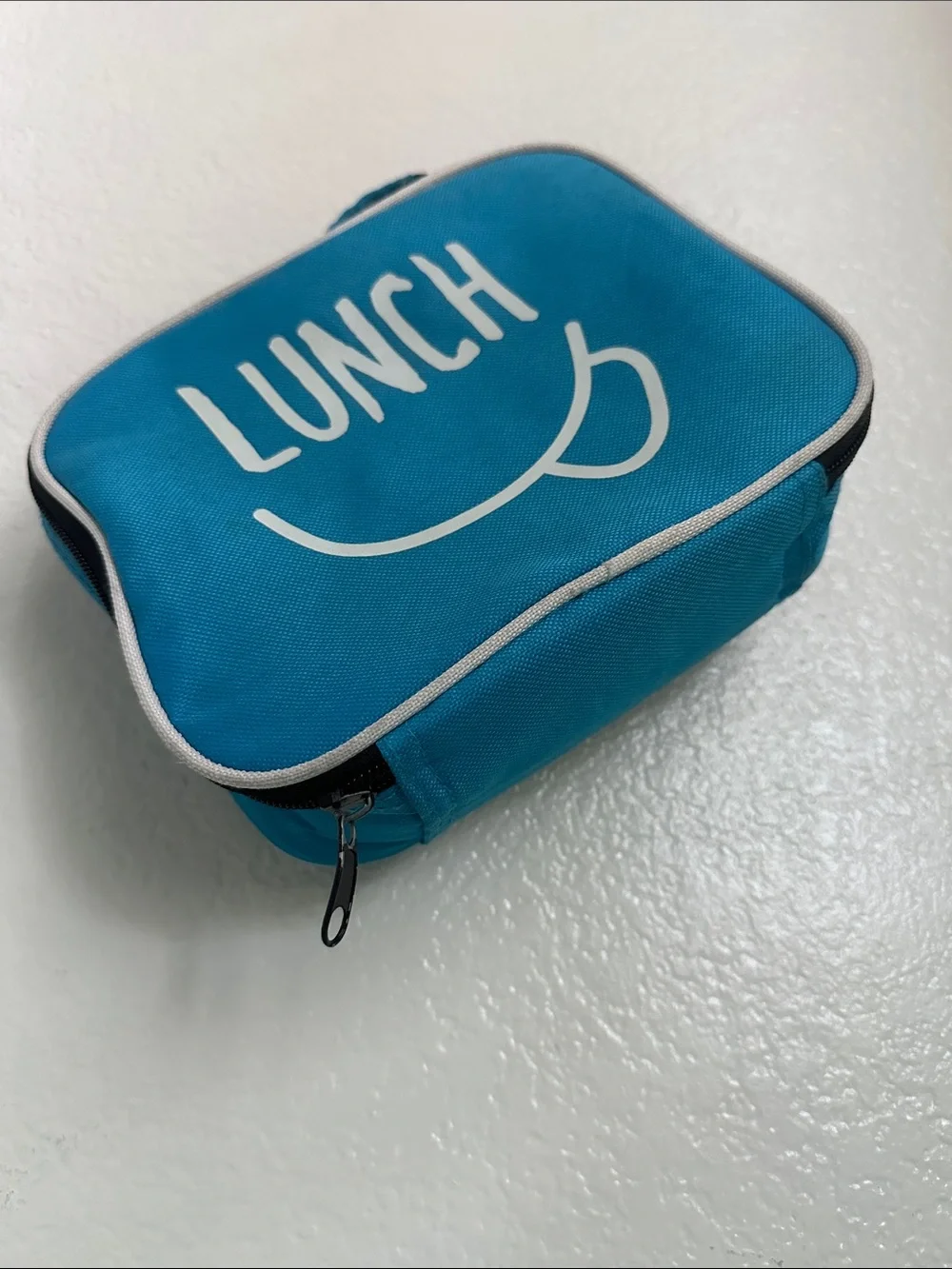 Walmart blue insulated lunch box with a minimalist white ’LUNCH’ graphic-used